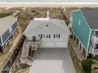 1001 Ocean Boulevard W, Holden Beach, NC 28462 — 3-bedroom waterfront home in Colonial Beach, Holden Beach, NC, photo 1 of 37: Front of Home