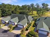 507 Sunset Oaks Lane, Sunset Beach, NC 28468 — 3-bedroom townhome in Sunset Oaks Garden Homes, Sunset Beach, NC, photo 22 of 22: 62_front right aerial