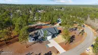 20 Forest Lake Drive, Jackson Springs, NC 27281 — 4-bedroom home in Foxfire Village East, Jackson Springs, NC, photo 1 of 33: 6-web-or-mls-DJI_20251210122519_0304_D