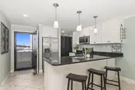 1505 Salter Path Road 235 Summer Winds, Indian Beach, NC 28512 — 3-bedroom waterfront condo in Summer Winds Condominiums, Indian Beach, NC, photo 5 of 46: Kitchen w/ peninsula seating