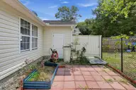 121 NE 6th Street, Oak Island, NC 28465 — 3-bedroom home in Tranquil Harbor, Oak Island, NC, photo 18 of 21: 04_121_NE_6th_St-Exterior-GE22