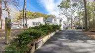 246 Oakleaf Drive, Pine Knoll Shores, NC 28512 — 5-bedroom waterfront home in Crosby Cove, Pine Knoll Shores, NC, photo 3 of 77: 3-custom-chadwick-visuals-246-oakleaf-dr