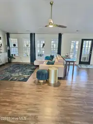 117 Halls Creek Drive, Swansboro, NC 28584 — 4-bedroom waterfront home in Halls Creek At The Hammocks, Swansboro, NC, photo 13 of 38: living room 1