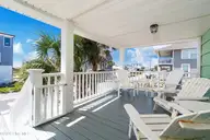 401 E Atlantic Boulevard, Atlantic Beach, NC 28512 — 4-bedroom waterfront home, Atlantic Beach, NC, photo 17 of 61: Front porch view