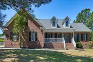 39 Winding Trail, Whispering Pines, NC 28327 — 4-bedroom home in Whispering Winds, Whispering Pines, NC, photo 1 of 49: 1-72_39 Winding Trail, Carthage, NC 2832