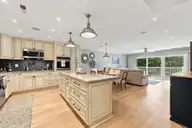 855 Salter Path Road 115, Indian Beach, NC 28512 — 2-bedroom waterfront condo in Colony By The Sea, Indian Beach, NC, photo 14 of 26: Kitchen to dining and living