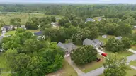 132 42 Quail Woods Drive, New Bern, NC 28560 — lot in Quail Woods Village, Ltd, New Bern, NC, photo 1 of 6: 10-web-or-mls-DJI_20260511130249_0363_D