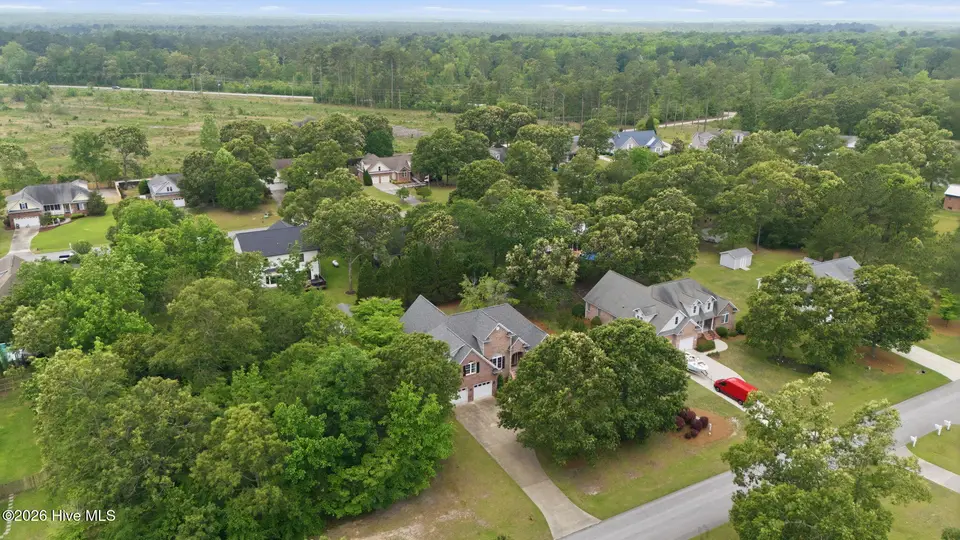 132 42 Quail Woods Drive, New Bern, NC 28560 — lot in Quail Woods Village, Ltd, New Bern, NC, photo 1 of 6: 10-web-or-mls-DJI_20260511130249_0363_D