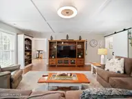 419 Riverside Lane, Stella, NC 28582 — 4-bedroom waterfront home in Riverside Plant, Stella, NC, photo 12 of 36: living room