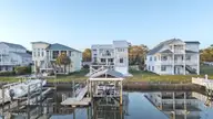 103 E Island Drive, Oak Island, NC 28465 — 3-bedroom waterfront home, Oak Island, NC, photo 3 of 76: 77_twilight