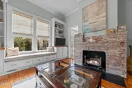 901 N Main Street, Tarboro, NC 27886 — 3-bedroom home in Historic District, Tarboro, NC, photo 17 of 55: Family room with fireplace