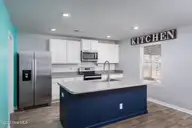 67 Fresh Air Drive, Hampstead, NC 28443 — 3-bedroom home in Hope Creek, Hampstead, NC, photo 6 of 45: Large, open kitchen