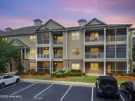 221 Woodlands Way Unit 21, Calabash, NC 28467 — 2-bedroom condo in Crow Creek, Calabash, NC, photo 4 of 39: Parking View in Evening