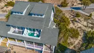 811 S Bald Head Wynd # B, Bald Head Island, NC 28461 — 3-bedroom waterfront townhome in BHI Stage I & II Flora's Bluff, Bald Head Island, NC, photo 7 of 54: DJI_20260217104701_0002_D-Edit