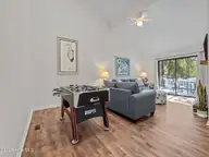 131 Oakleaf Drive, Pine Knoll Shores, NC 28512 — 3-bedroom waterfront home in Piksco, Pine Knoll Shores, NC, photo 14 of 35: Living Room