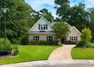 101 Beaumont Circle, Hampstead, NC 28443 — 4-bedroom waterfront home in Crown Pointe, Hampstead, NC, photo 1 of 42: front house