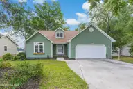 704 Shoreline Drive E, Sunset Beach, NC 28468 — 3-bedroom home in Waterway Estates, Sunset Beach, NC, photo 1 of 38: Front