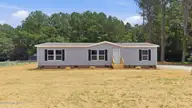 9757 Fire Tower Farm Road, Whitakers, NC 27891 — 3-bedroom manufactured home in Swift Creek Fire Tower, Whitakers, NC, photo 1 of 48: 1-web-or-mls-DJI_20260820132050_0543_D-E