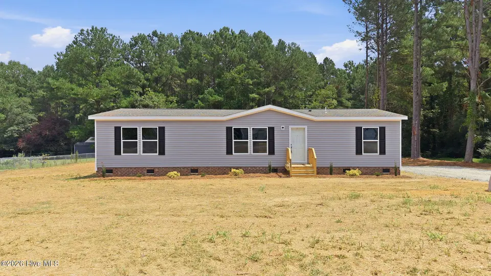 9757 Fire Tower Farm Road, Whitakers, NC 27891 — 3-bedroom manufactured home in Swift Creek Fire Tower, Whitakers, NC, photo 1 of 48: 1-web-or-mls-DJI_20260820132050_0543_D-E