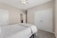 155 Lincoln Place Circle, Leland, NC 28451 — 3-bedroom townhome in Lincoln Place Townhomes, Leland, NC, photo 19 of 39: Downstairs Bedroom