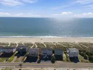 134 Ocean Boulevard E, Holden Beach, NC 28462 — 4-bedroom waterfront home in Holden Beach, Holden Beach, NC, photo 2 of 48: 3-web-or-mls-DJI_20261014131252_0898_D