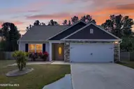 429 Poppleton Drive, Hampstead, NC 28443 — 3-bedroom home in Harrison Cove, Hampstead, NC, photo 1 of 47: 429PoppletonDrive-2_Dusk