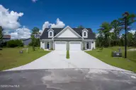 308 Coastal Reef Court, Holly Ridge, NC 28445 — 4-bedroom townhome in Coastal Village, Holly Ridge, NC, photo 1 of 16