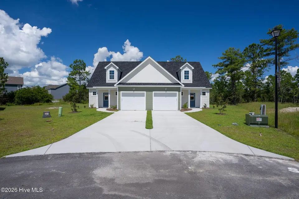 308 Coastal Reef Court, Holly Ridge, NC 28445 — 4-bedroom townhome in Coastal Village, Holly Ridge, NC, photo 1 of 16
