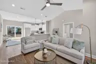 9579 Lily Pond Court NE, Leland, NC 28451 — 3-bedroom home in Lily Pond, Leland, NC, photo 10 of 33: Living room to kitchen
