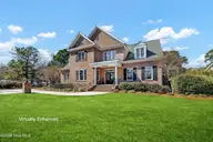 901 Sun Runner Place, Wilmington, NC 28405 — 4-bedroom home in Landfall, Wilmington, NC, photo 1 of 66: Front with green grass