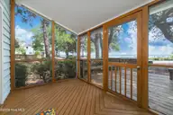 142 Lagoon Lane, Pine Knoll Shores, NC 28512 — 3-bedroom waterfront condo in Mcginnis Point, Pine Knoll Shores, NC, photo 3 of 41: Screened Porch w/ Sound Views