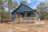 147 Creek Bend Drive, Vass, NC 28394 — 2-bedroom home in Riverview Acres, Vass, NC, photo 13 of 32: Spacious Front Yard