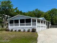 1510 Kings Landing Road, Hampstead, NC 28443 — 2-bedroom waterfront manufactured home in Sidbury Acres, Hampstead, NC, photo 1 of 39