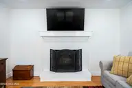 810 Bragg Drive, Wilmington, NC 28409 — 3-bedroom home in Pine Valley Estates, Wilmington, NC, photo 20 of 68: Fireplace in Den