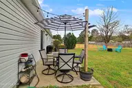 3107 Harvest Road, Castle Hayne, NC 28429 — 3-bedroom home in Apple Valley, Castle Hayne, NC, photo 18 of 20: Harvest bk yard patio