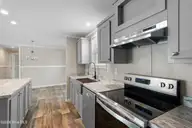 6830 Lewis Drive SE, Winnabow, NC 28479 — 3-bedroom manufactured home in Lewis Acres, Winnabow, NC, photo 16 of 29: Kitchen