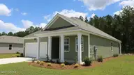 1307 Woodhouse Drive NW, Ash, NC 28420 — 3-bedroom home in Brunswick Plantation, Ash, NC, photo 4 of 23: Aria_H_Right_Side