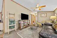 1221 Arvida Spur Road, Rocky Point, NC 28457 — 4-bedroom manufactured home in Arvida Lands, Rocky Point, NC, photo 23 of 44: 26_family room