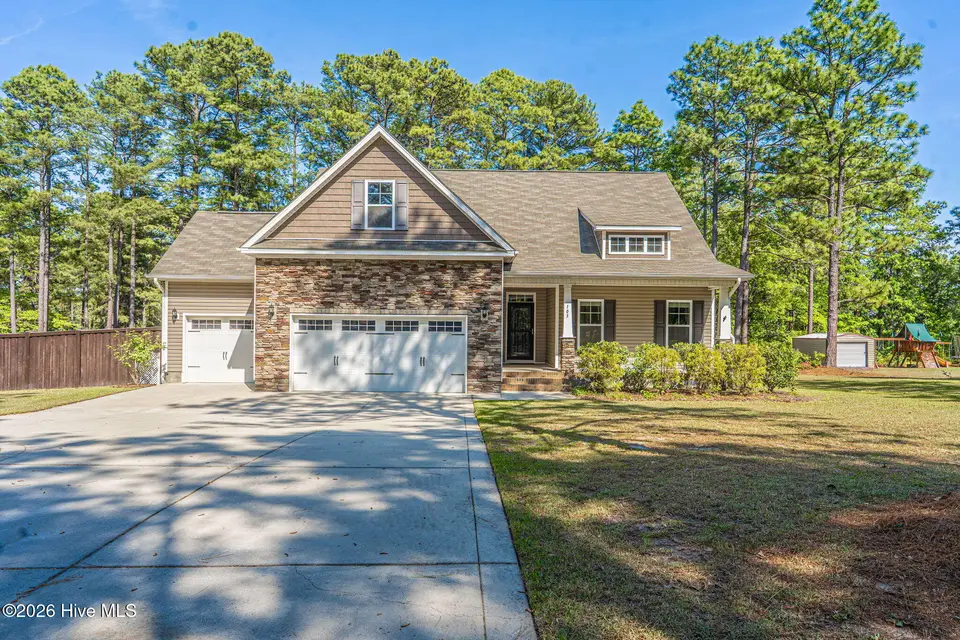 103 Laurel Oak Lane, Pinebluff, NC 28373 — 4-bedroom home in The Pines, Pinebluff, NC, photo 1 of 34: Front Elevation