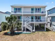 135 Starfish Drive, Holden Beach, NC 28462 — 4-bedroom waterfront home in Heritage Harbor, Holden Beach, NC, photo 1 of 75