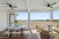 26 Solstice Way, Hampstead, NC 28443 — 4-bedroom waterfront home in East Wynd, Hampstead, NC, photo 13 of 55: Screened Porch