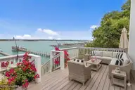 8722 Emerald Plantation Road, Emerald Isle, NC 28594 — 4-bedroom waterfront home in Emerald Plantation, Emerald Isle, NC, photo 7 of 63: 8722 EP Deck Virtually Staged