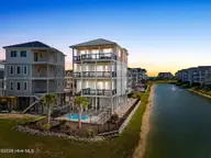 13 Via Dolorosa Drive, Ocean Isle Beach, NC 28469 — 6-bedroom waterfront home in Islander Resort, Ocean Isle Beach, NC, photo 1 of 74: 13 Via Dolorosa