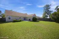 1104 Crestfield Way, Leland, NC 28451 — 3-bedroom home in Windsor Park, Leland, NC, photo 6 of 49: Spacious, flat fenced backyard