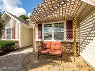 423 Blue Pennant Court, Sneads Ferry, NC 28460 — 3-bedroom home in Oyster Landing, Sneads Ferry, NC, photo 12 of 35: Front Patio