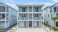 26 Grand View Drive, Ocean Isle Beach, NC 28469 — 6-bedroom waterfront home in The Pointe at Ocean Isle Beach, Ocean Isle Beach, NC, photo 1 of 70: Front elevation