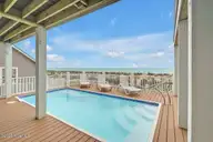 4005 E Beach Drive, Oak Island, NC 28465 — 7-bedroom waterfront home in E. Long Beach, Oak Island, NC, photo 2 of 65: Affinity 2
