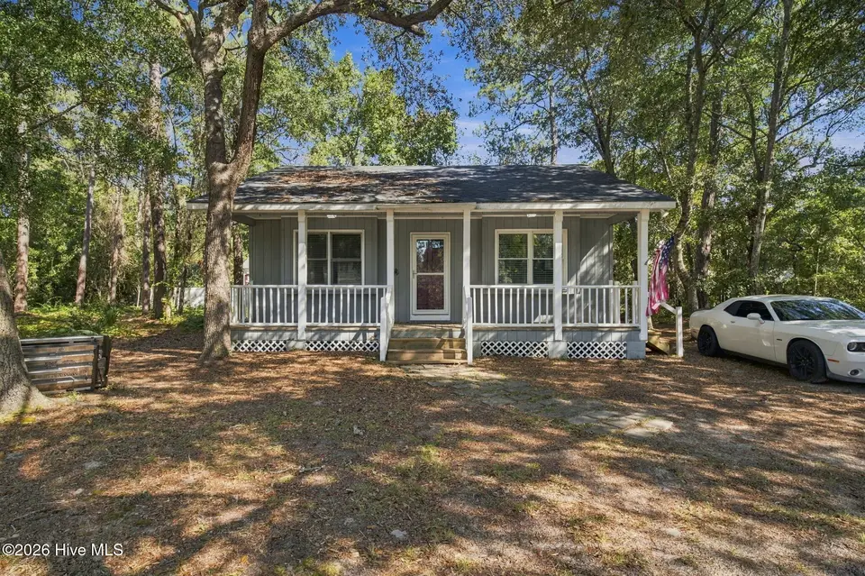 114 NW 23rd Street, Oak Island, NC 28465 — 2-bedroom waterfront home in Pinners Point, Oak Island, NC, photo 1 of 32: 30-web-or-mls-DSC09417