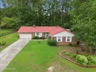 900 Welsh Lane, Jacksonville, NC 28546 — 4-bedroom home in Village of Country Club Hills, Jacksonville, NC, photo 1 of 45