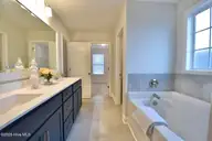 59 S Bandwheel Way, Hampstead, NC 28443 — 4-bedroom home in Sawyers Run, Hampstead, NC, photo 14 of 30: Primary Suite Bath